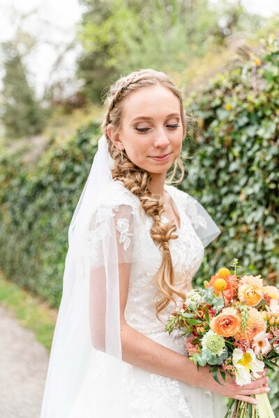 Utah bridal shoot with wedding dress and colorful bouquet of flowers.