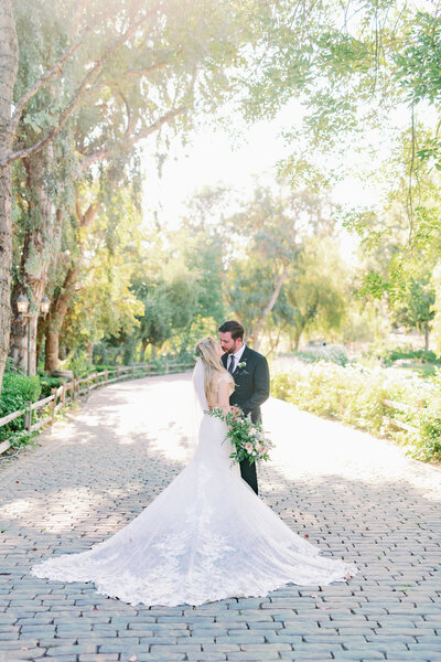Boho Bride and Groom snuggle up for romantics for their wedding in Temecula Ca