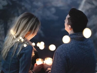 couple holding candles