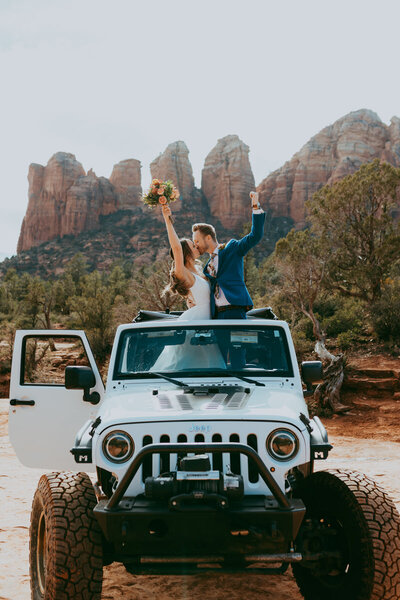 bride and groom kissing  in jeep in sedona arizona