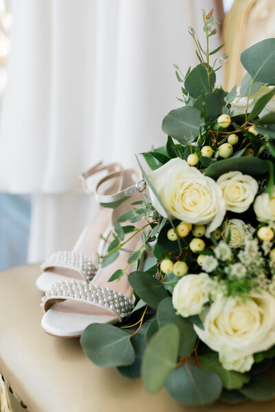 Bride's shoes, flowers, and dress at Bavaria Downs