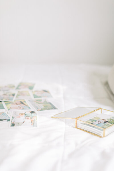 photo of glass photo box of photo prints taken and printed by newborn photography madison wi Talia Laird Photography