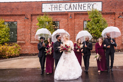 Bridal Party walk down the road at the Cannery wedding venue in Eureka, Illinois.