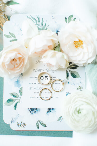 flowers, rings and wedding invite
