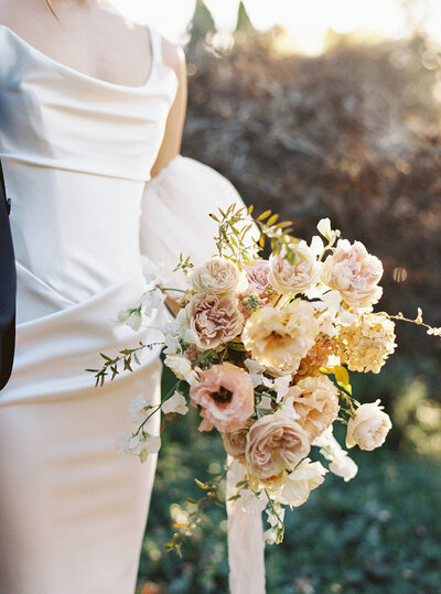 Bride and groom walk up memorial steps at their DC wedding