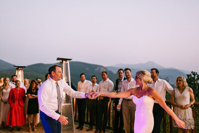Photo of father daughter dance outside during sunset at The Lodge at Breckenridge