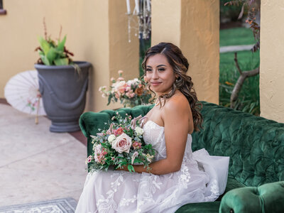 Captivating image of a radiant Latina bride holding her bouquet, framed by the natural splendor of Half Moon Bay, capturing a moment of pure elegance.