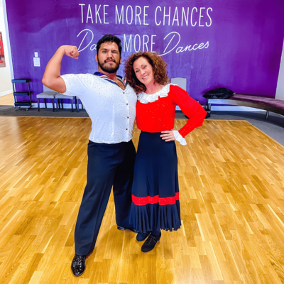 A satisfied student showcases their progress in country dance lessons, thanks to the affordable New Student Special offered by AZ Ballroom Champions and their dedicated, professional teachers.