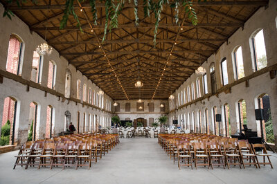 Wide-angle-image-of-the-interior-of-the-Providence-Cotton-Mill-with-ceremony-and-reception-decor-in-place
