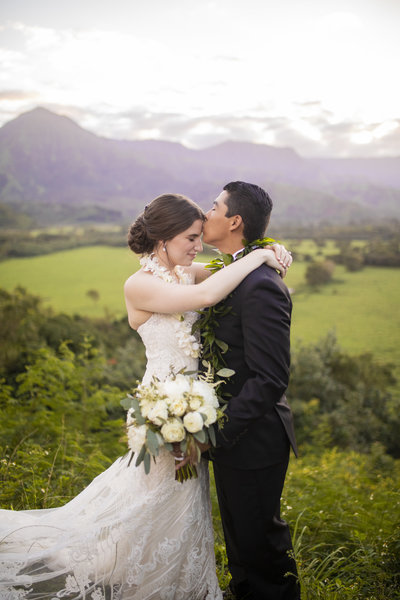 Wedding Photography, groom kissing bride's forehead