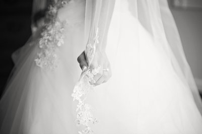 bride holding veil at clarks landing yacht club wedding