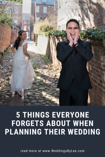 Funny photo of groom with hands on face looking shock as his bride is running away down a cobble stone road. Photographed by  a DC wedding photographer, Lee Hickman