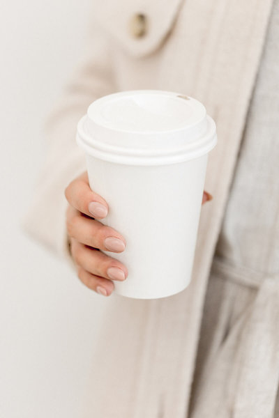 female-entrepreneur-holding-coffee-cup