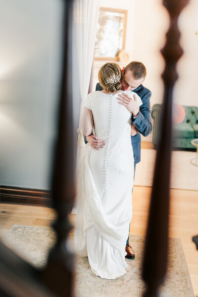 Intimate embrace between a bride and groom at their Bella Donna Chapel wedding.