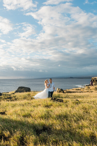 big island wedding couple on cliffs at sunset