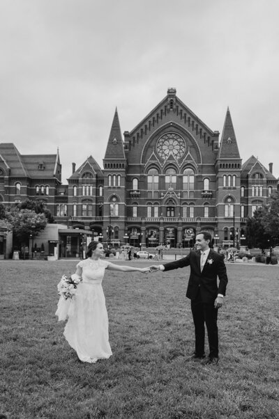bride and groom hugging outside a church