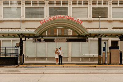 couple at the train station on elopement day