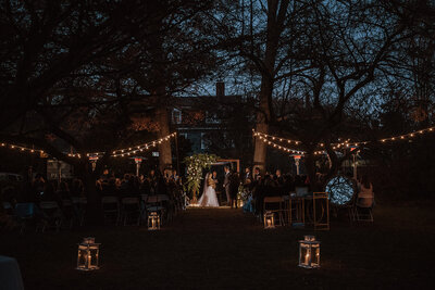 Wedding ceremony with lanterns along aisle and string lights, Salem weddign