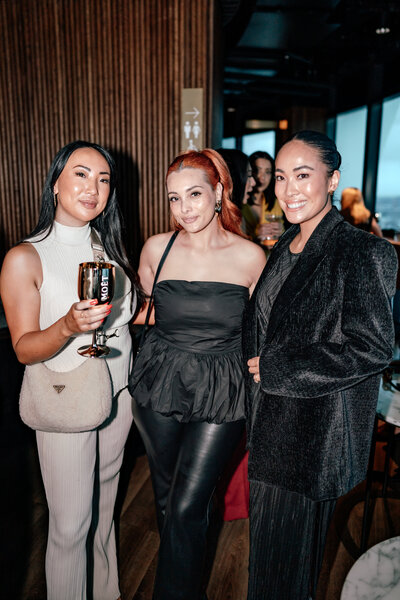 Influencer Iyia Liu and Trish Peng with another business woman standing together looking at the camera captured by Zanthe Vorsatz Photography- Auckland Event Photographer
