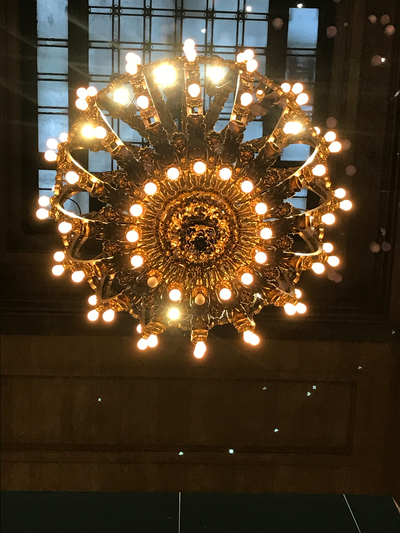 bright chandelier with window in the background