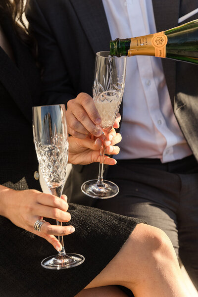 engaged couple enjoying champagne
