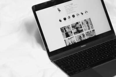 Black and white photo of a laptop open to Instagram