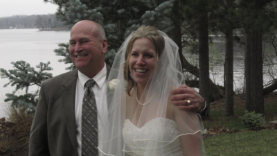 bride and dad smiling together