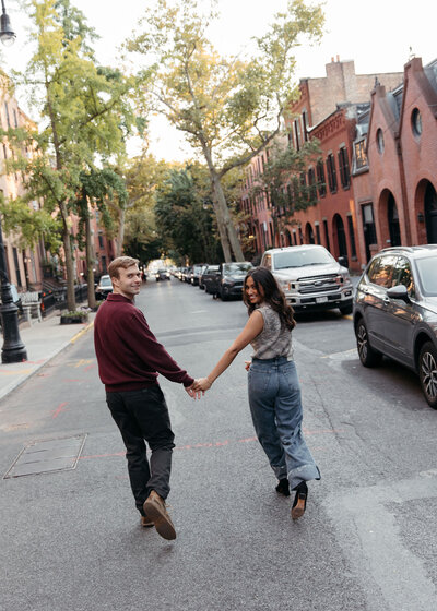 couple photos engagement photos couple hugging looking at camera studio shoot in brooklyn wedding photographer
