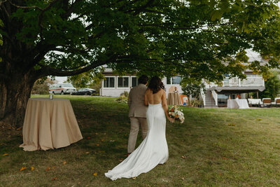 Couple walking away from camera - New England Wedding Planner
