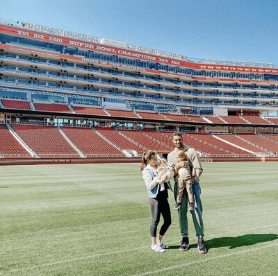 family photo inside NFL football stadium