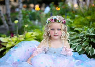 Girl in lush flowers wearing star gown