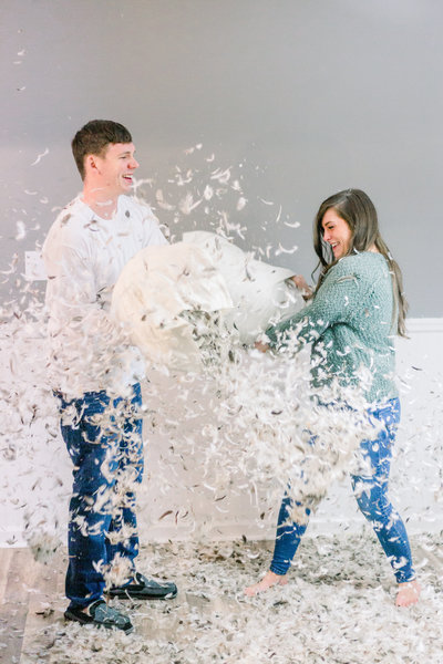 Fun pillow fight session with Georgia couple captured by Staci Addison Photography