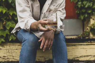Blaize & Brooks Bourbon. Woman drinking bourbon.