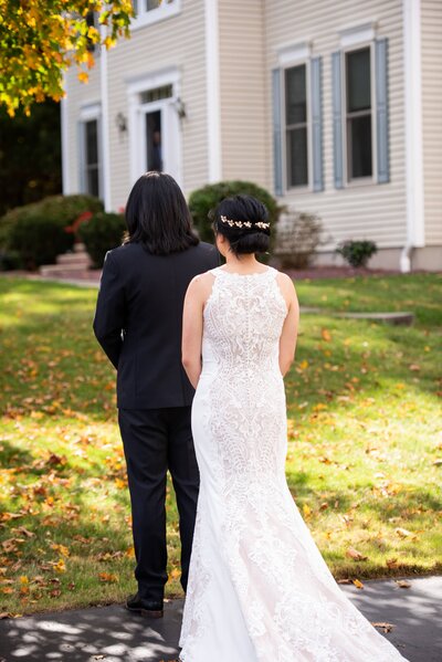 Bride standing behind groom who is turned away - UME (New England Wedding Planners) were part of the day