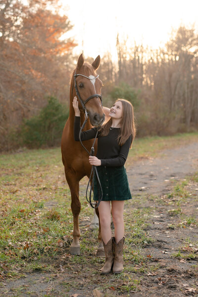 girl looking up at her horse