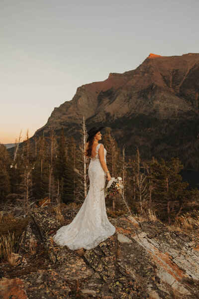 bride posing by mountain