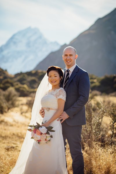 bride and groom in the southern alps