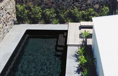 High contrast contemporary backyard with bold black and white color scheme and geometric designs.