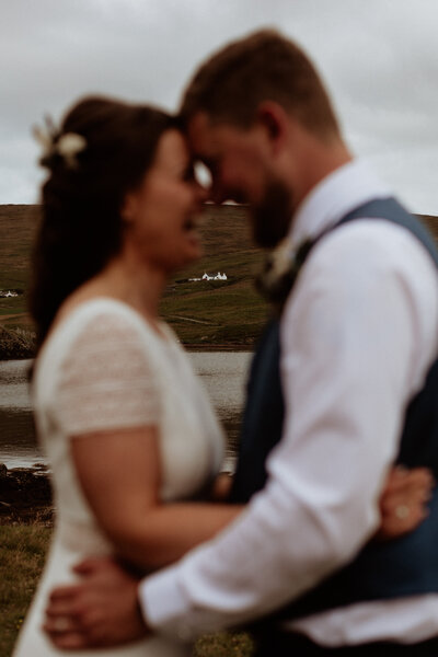 bride and groom in front of their house