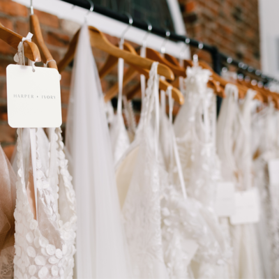 Wedding dresses hanging on wooden hangers