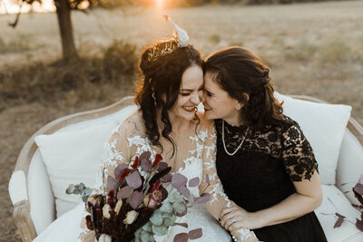 Lesbian brides laughing together