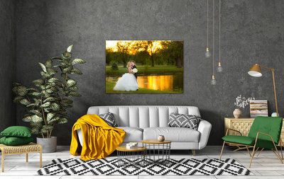 Large framed wedding photo on a gray wall in a living room.