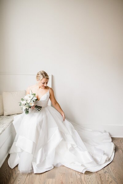 Bride looking at wedding dress train by Knoxville Wedding Photographer, Amanda May Photos