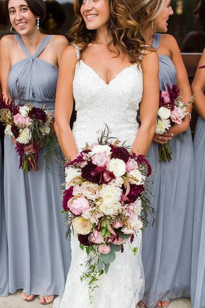textured wedding bouquet with greens, whites, and purples at oaks lakeside wedding