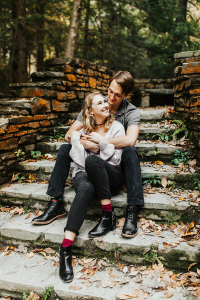 couple sitting on stairs and embracing