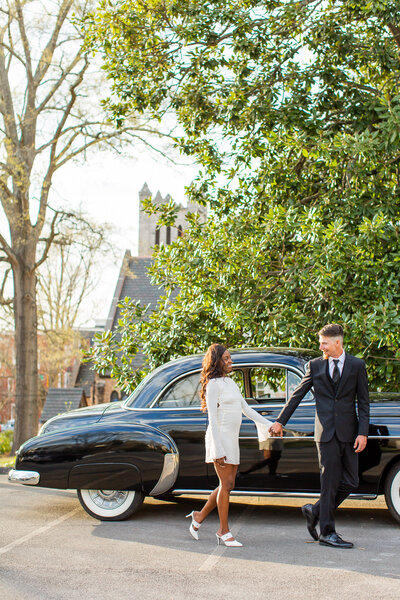 engaged couple sitting with their arms wrapped around each other
