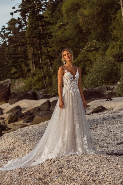 Seasons change, trends evolve, but our money is on the budget-friendly minimalist tiered tulle ball gown wedding dress mainstay. (Your bridal portraits will be divine.)