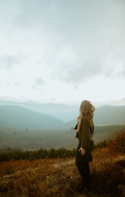 woman looking out to the mountains