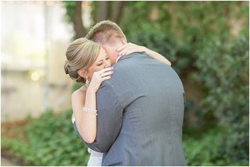 bride and groom embrace at Twigs garden wedding