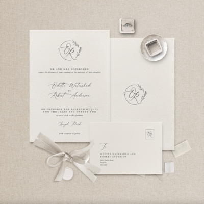 Flat lay of illustrated wedding stationery suite